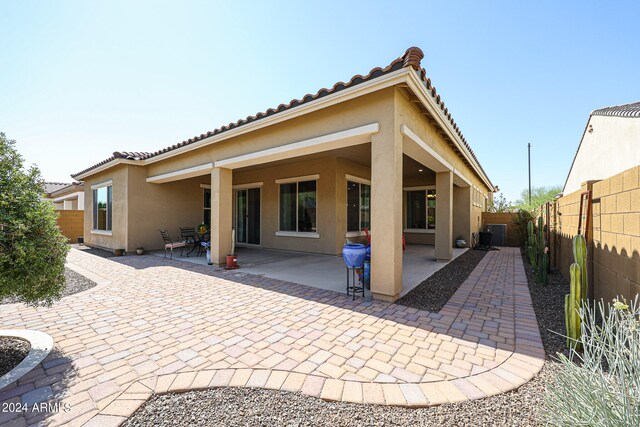 rear view of house with a patio