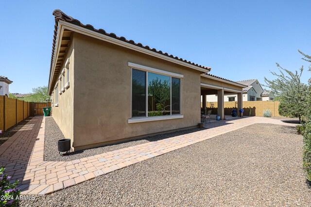 rear view of property featuring a patio