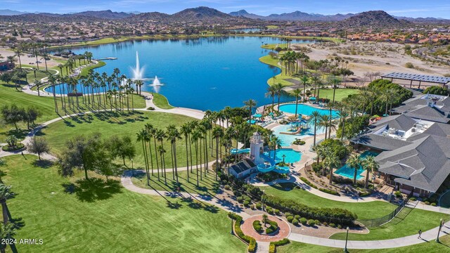 drone / aerial view with a water and mountain view