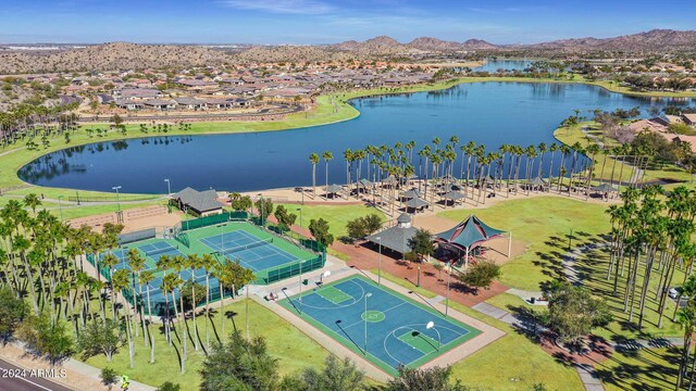 birds eye view of property with a water and mountain view