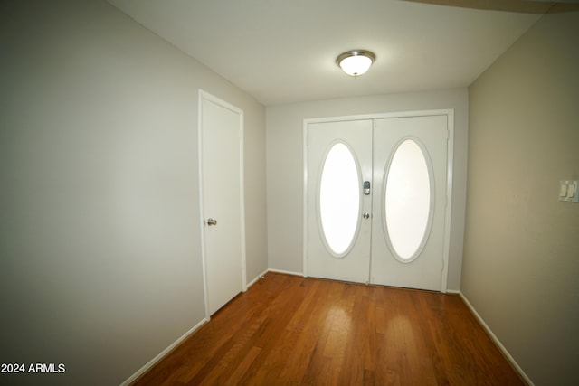 foyer entrance with hardwood / wood-style flooring