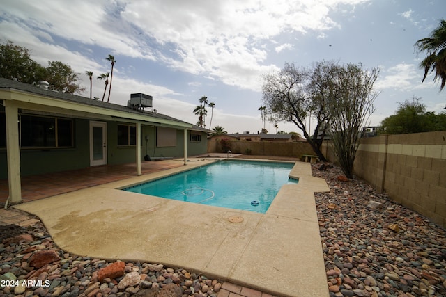 view of swimming pool with a patio