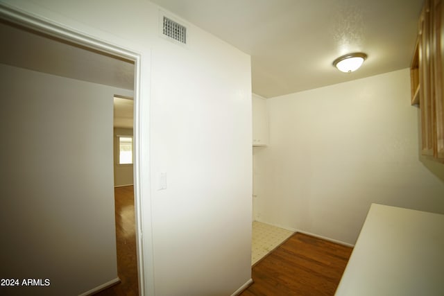 corridor featuring dark hardwood / wood-style floors