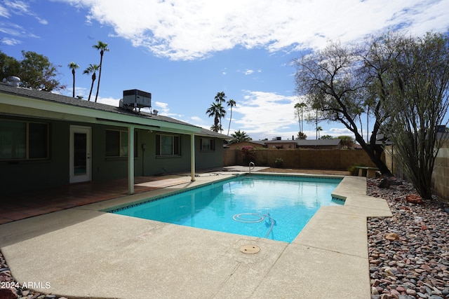 view of swimming pool featuring a patio area