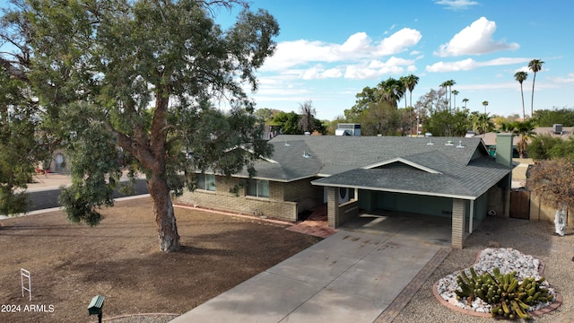 view of front of home featuring a carport