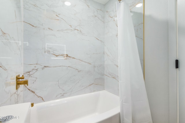 bathroom featuring shower / tub combo with curtain