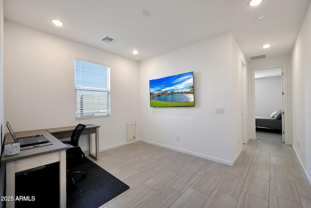 office area with recessed lighting, visible vents, and baseboards