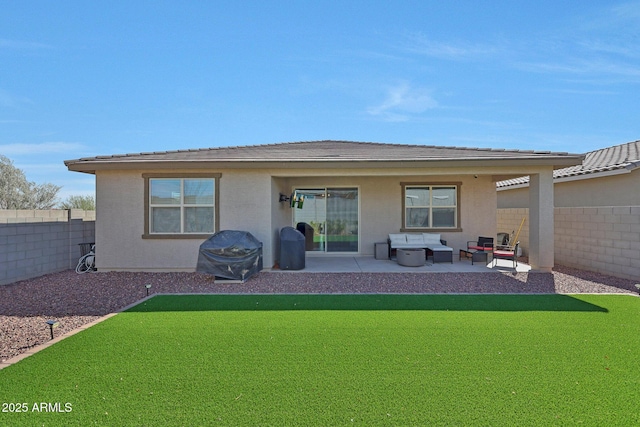 back of house featuring a patio, stucco siding, a fenced backyard, and an outdoor hangout area