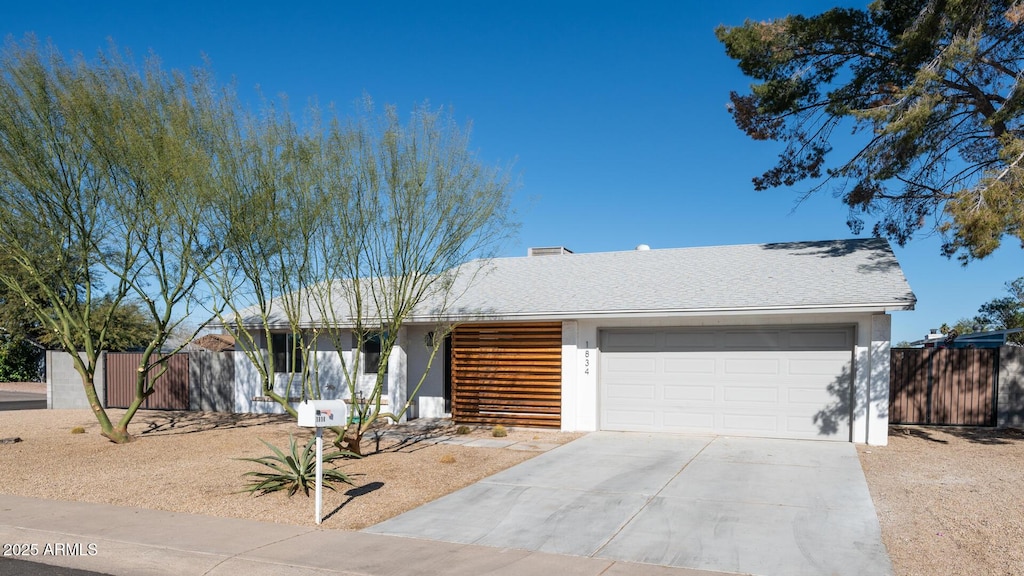 ranch-style house featuring a garage