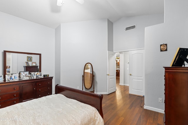 bedroom with dark wood-type flooring, ceiling fan, and lofted ceiling