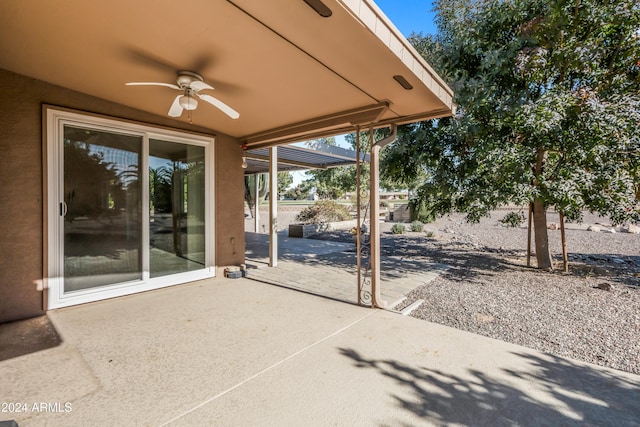 view of patio featuring ceiling fan