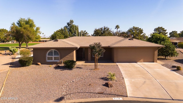 single story home featuring a garage