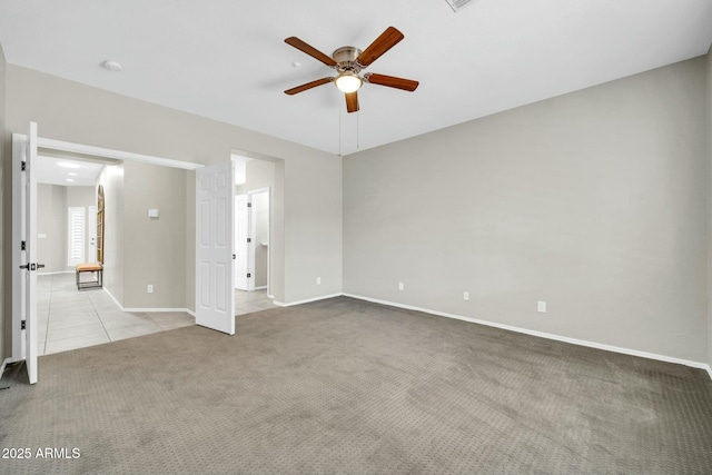 carpeted empty room with ceiling fan