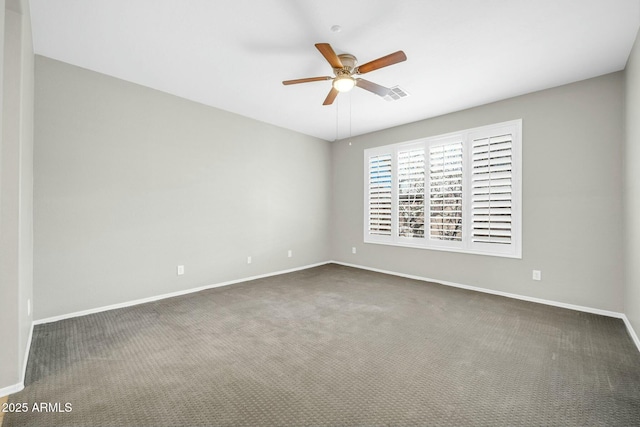 unfurnished room featuring ceiling fan and dark carpet