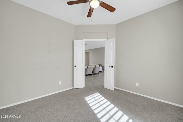 unfurnished bedroom featuring light colored carpet and ceiling fan