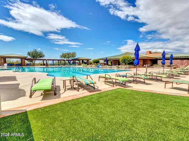 view of pool with a gazebo, a yard, and a patio area