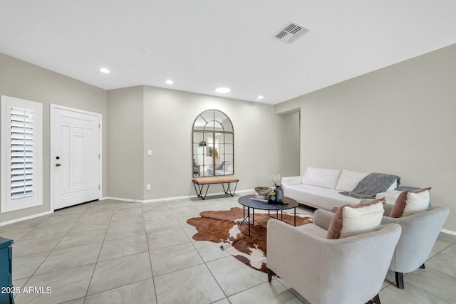 living room with light tile patterned flooring