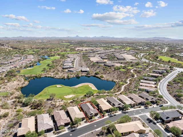 drone / aerial view featuring a water and mountain view