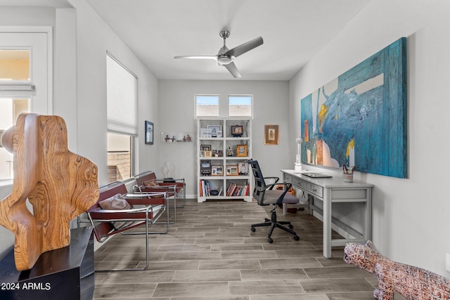 office featuring wood-type flooring and ceiling fan