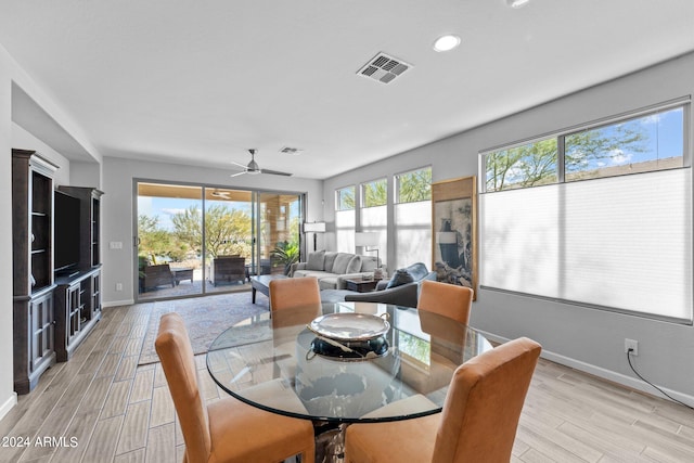 dining area featuring light hardwood / wood-style flooring and a healthy amount of sunlight