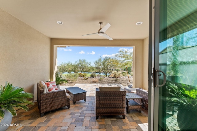 view of patio / terrace with an outdoor living space and ceiling fan