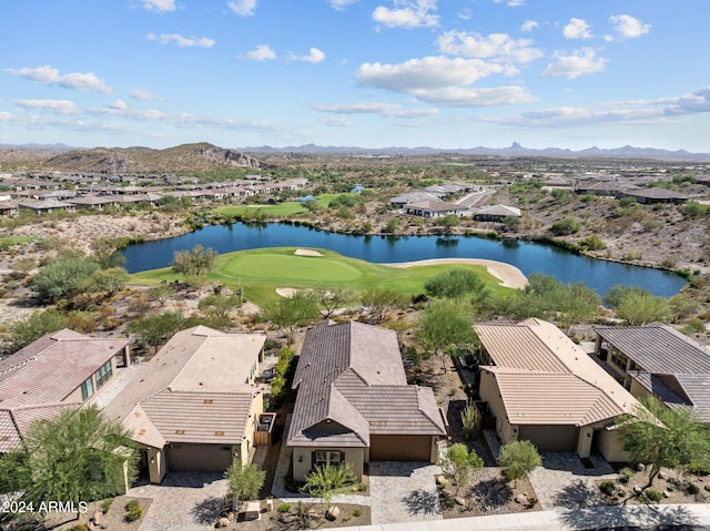 birds eye view of property with a water and mountain view