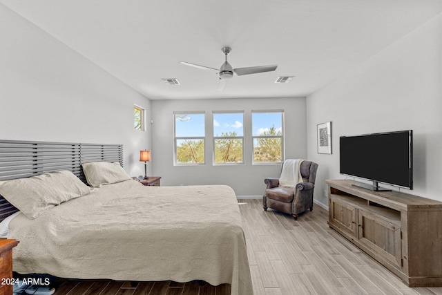 bedroom featuring light hardwood / wood-style flooring and ceiling fan