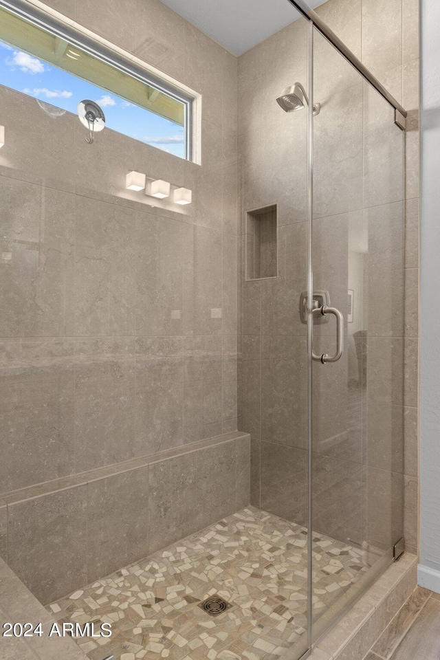 bathroom with an enclosed shower