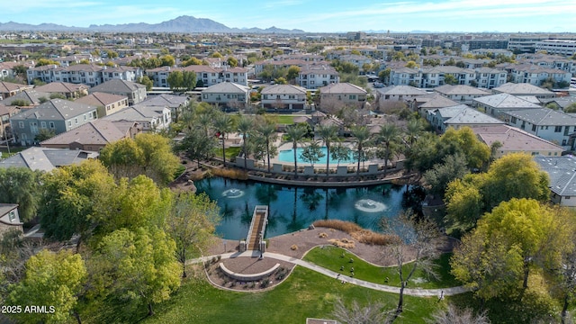 aerial view featuring a water and mountain view