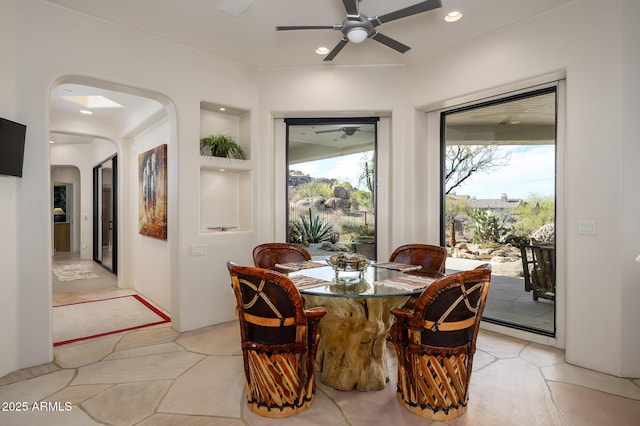 dining room featuring ceiling fan