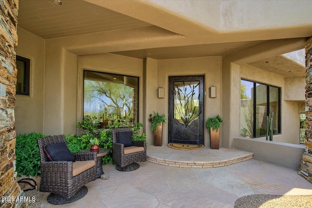 property entrance with a patio area