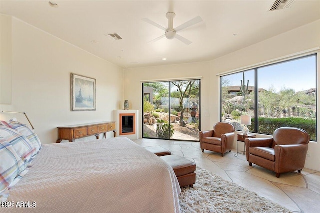 bedroom with ceiling fan and access to outside