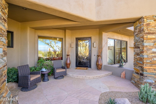 property entrance featuring a patio