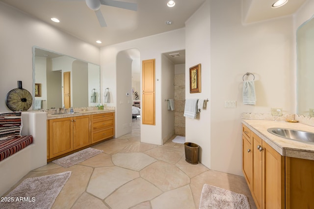 bathroom featuring vanity and ceiling fan