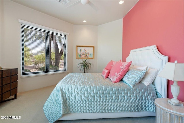 bedroom featuring ceiling fan and carpet