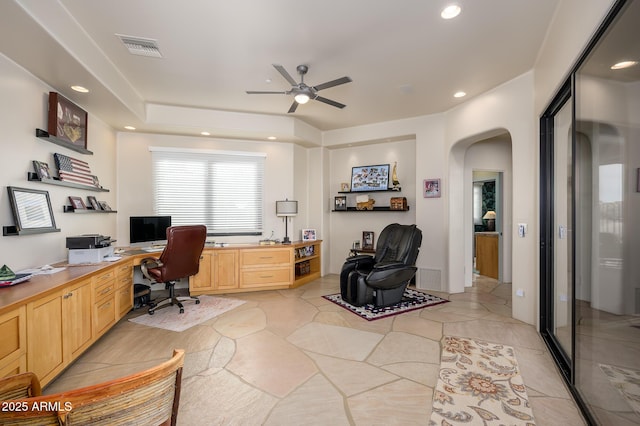 tiled office featuring ceiling fan