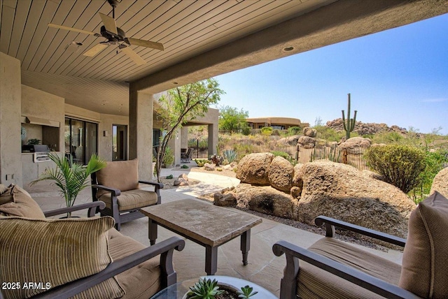 view of patio with ceiling fan and an outdoor hangout area