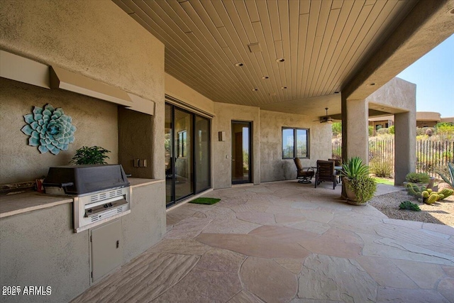 view of patio / terrace featuring ceiling fan, area for grilling, and grilling area