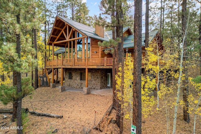 rear view of house with a deck