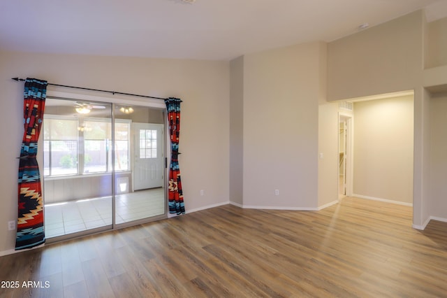 1563 E Peregrine Trl, Casa Grande, AZ 85122 - spare room with wood finished floors and baseboards