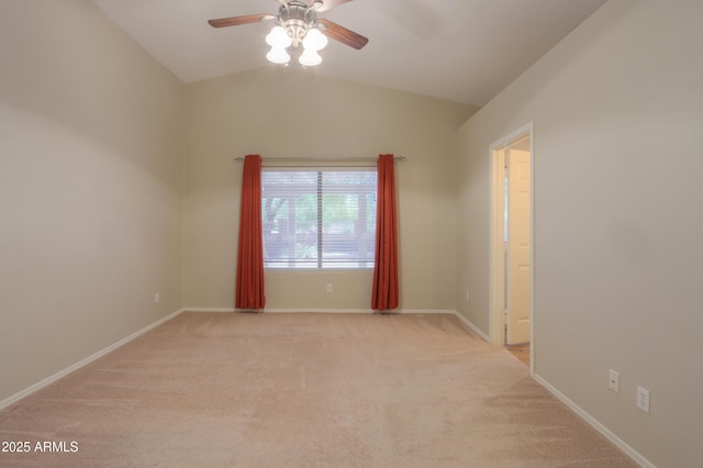 1563 E Peregrine Trl, Casa Grande, AZ 85122 - spare room featuring a ceiling fan, light colored carpet, lofted ceiling, and baseboards