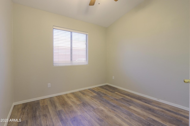 1563 E Peregrine Trl, Casa Grande, AZ 85122 - empty room with dark wood-type flooring, ceiling fan, lofted ceiling, and baseboards