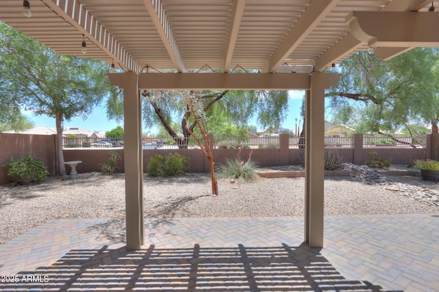 1563 E Peregrine Trl, Casa Grande, AZ 85122 - fenced backyard with a patio and a pergola