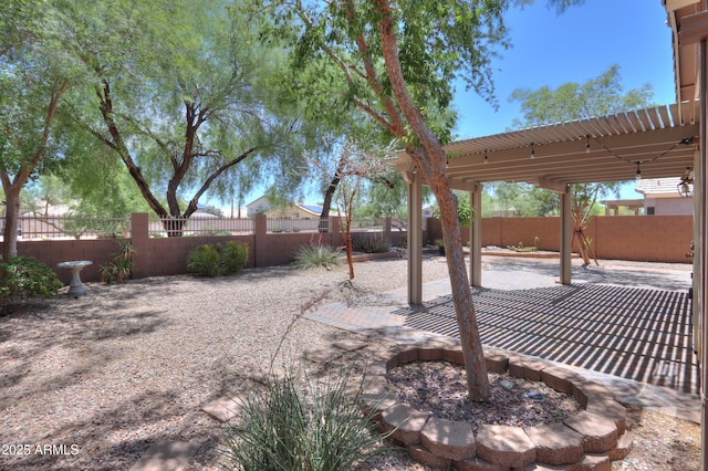 1563 E Peregrine Trl, Casa Grande, AZ 85122 - fenced backyard with a patio