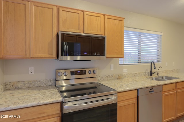 1563 E Peregrine Trl, Casa Grande, AZ 85122 - kitchen with appliances with stainless steel finishes, a sink, and light brown cabinets