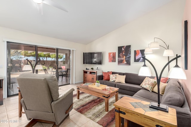 tiled living room with lofted ceiling and ceiling fan