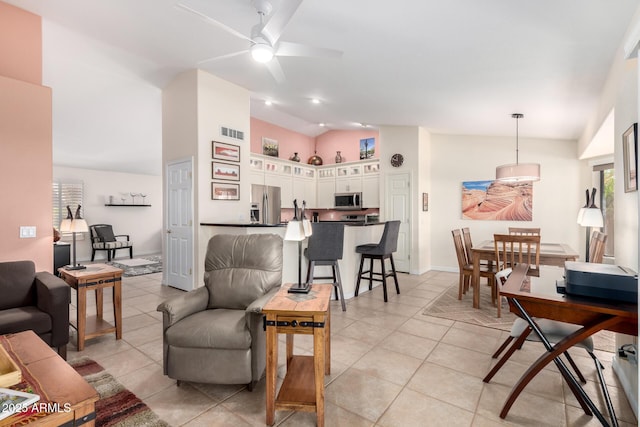 tiled living room with vaulted ceiling and ceiling fan