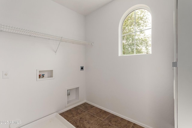 washroom with washer hookup, baseboards, laundry area, dark tile patterned flooring, and hookup for an electric dryer