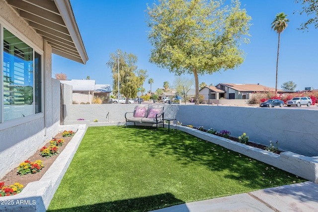 view of yard with a fenced backyard