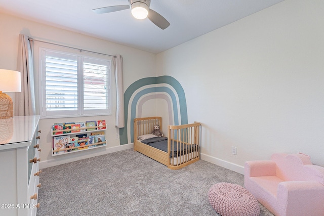 carpeted bedroom featuring a ceiling fan and baseboards